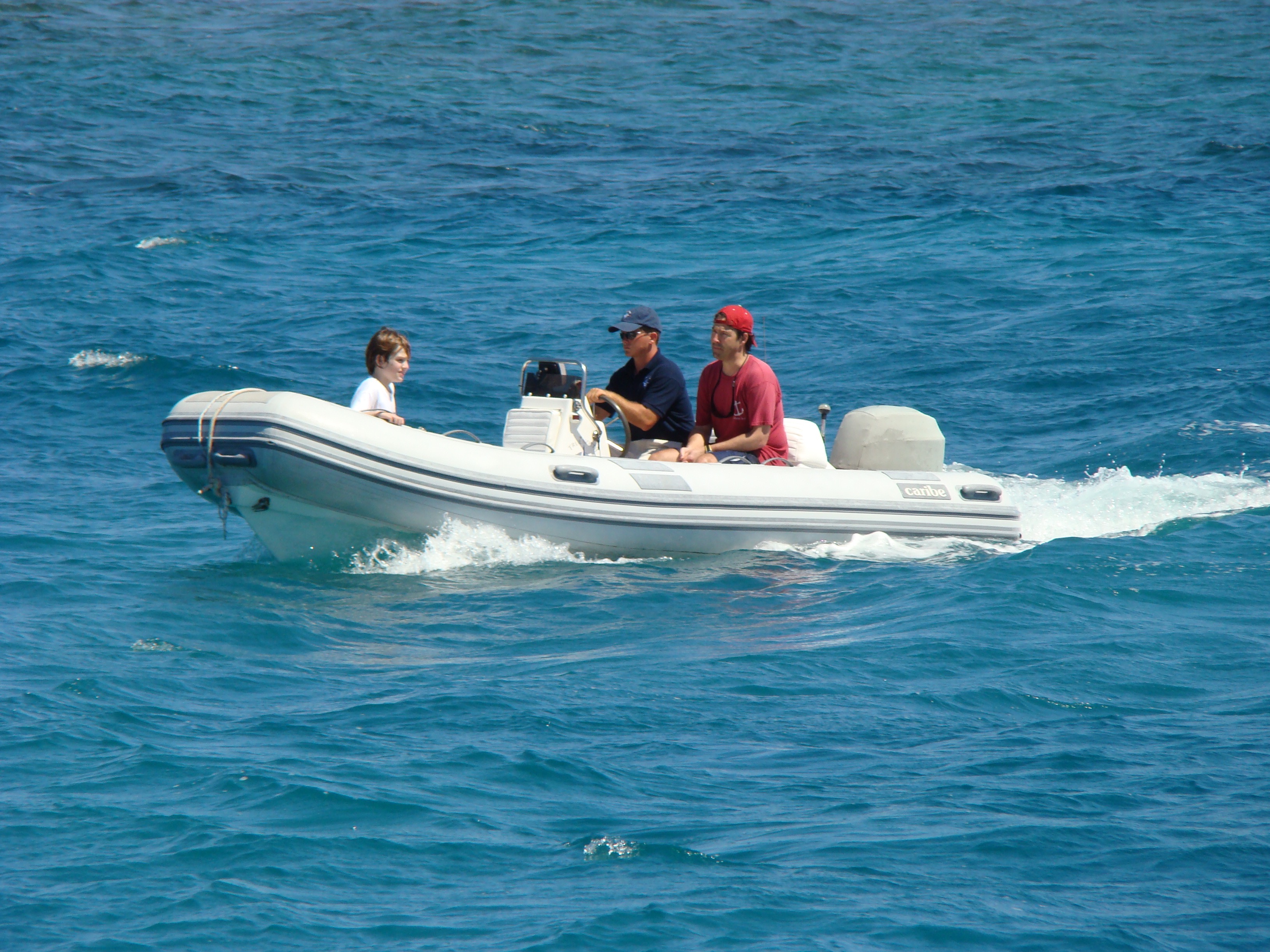 charter guests in dinghy